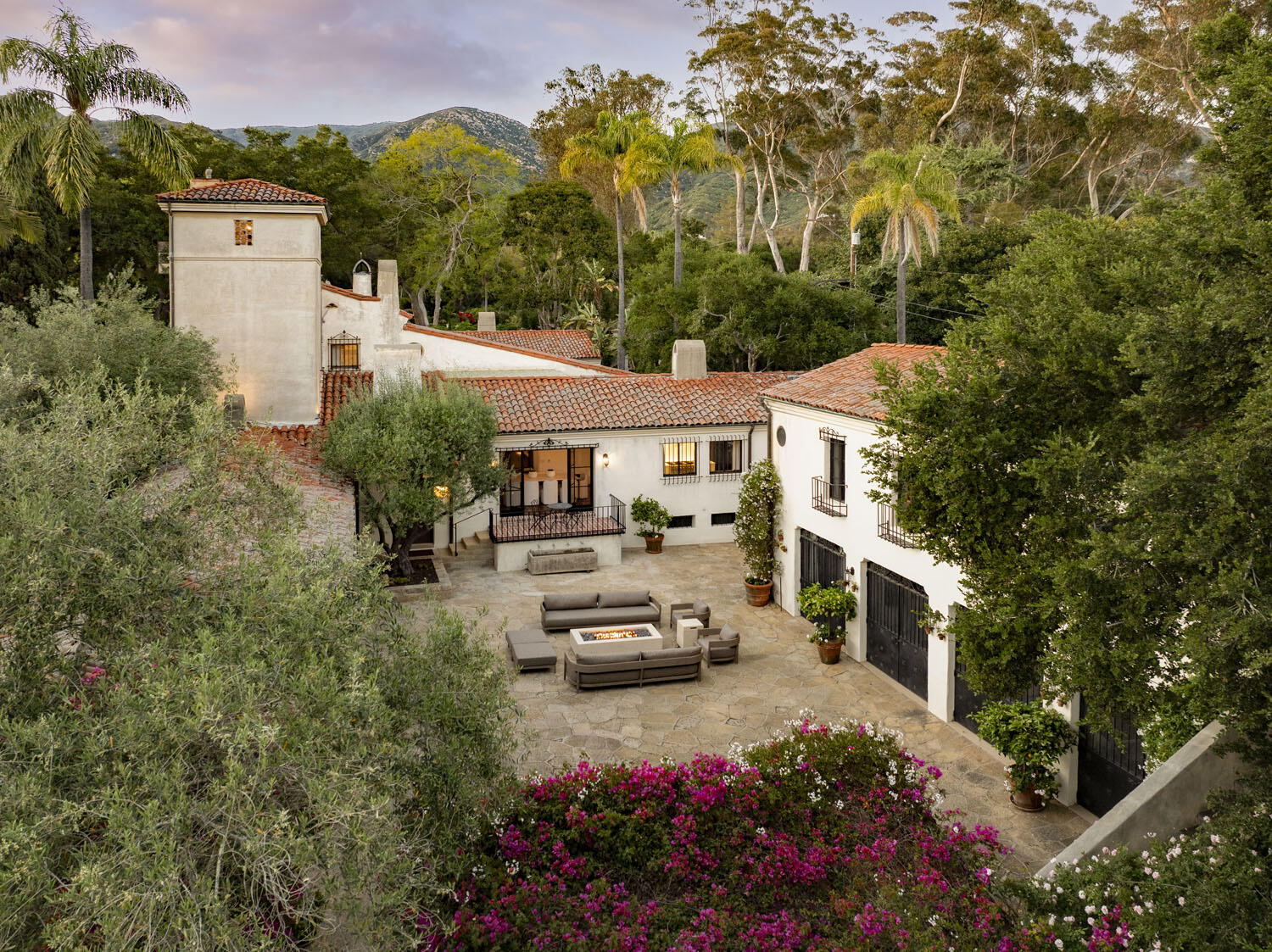 779 Ayala Lane Montecito, CA 93108 - Photo 5 of 58 a car parked in front of a house with a garden