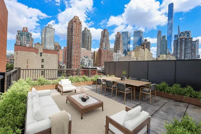 a view of a terrace with furniture