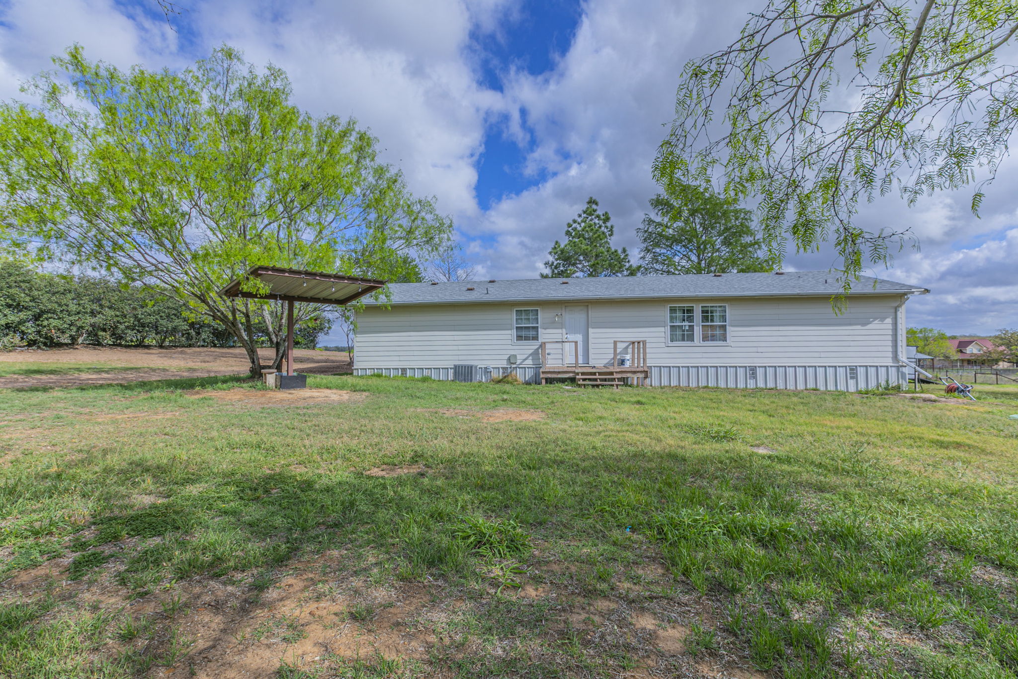 1767 Dowdy Road Seguin, TX 78155 - Photo 25 of 25 a view of a house with a backyard