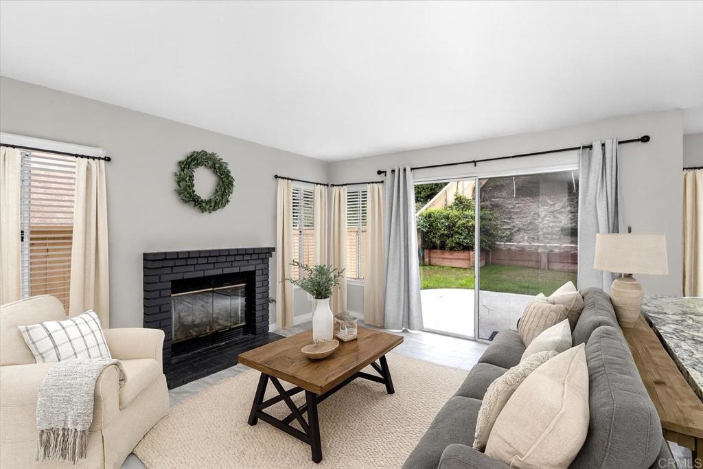 1533 Promontory Ridge Way Vista, CA 92081 - Photo 7 of 26 a living room with furniture and a fireplace