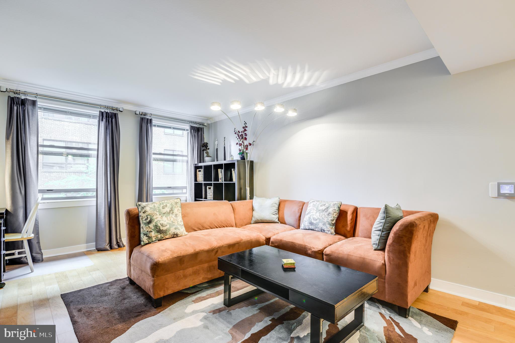 616 E Street Northwest, Unit 446 Washington, DC 20004 - Photo 13 of 66 a living room with furniture and a couch