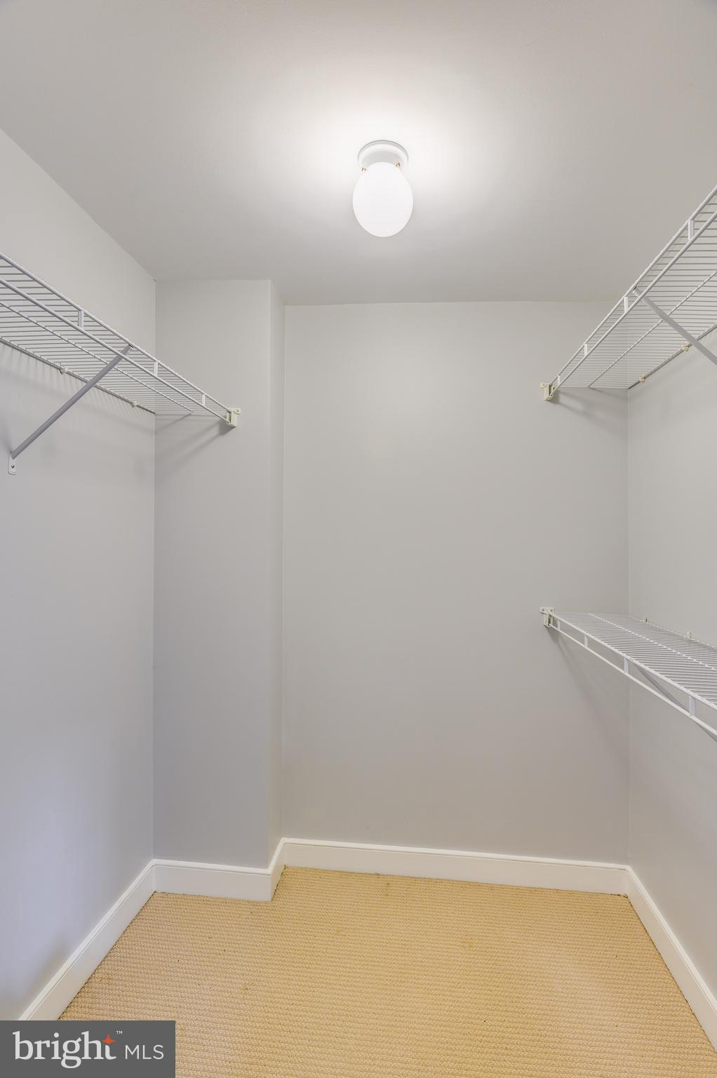 616 E Street Northwest, Unit 446 Washington, DC 20004 - Photo 18 of 66 a view of a room with racks on the wall