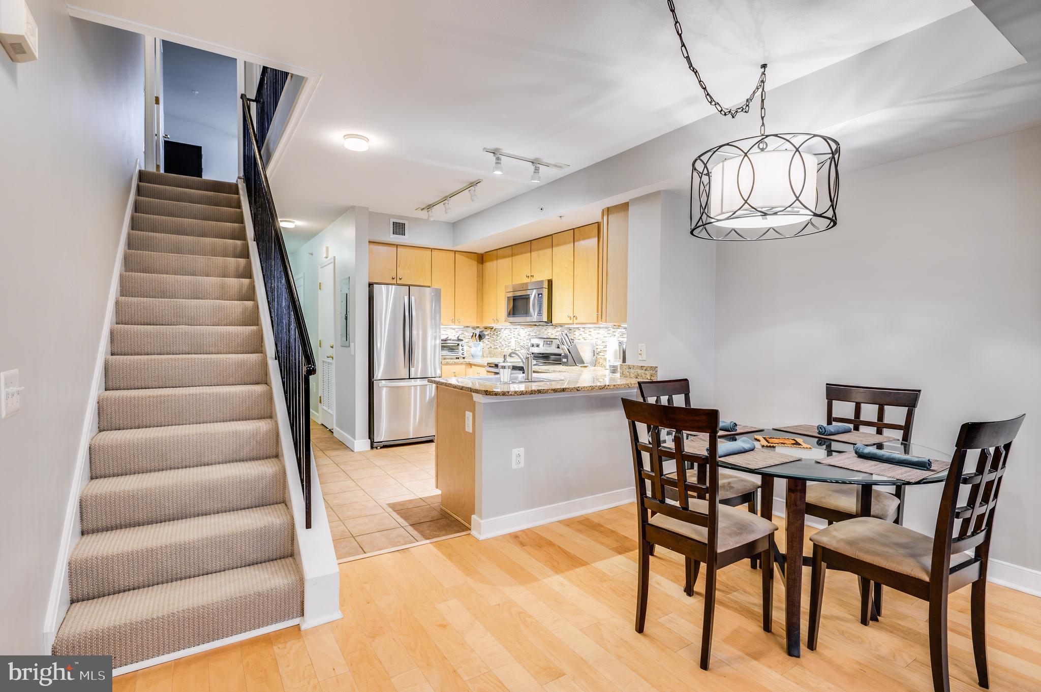 616 E Street Northwest, Unit 446 Washington, DC 20004 - Photo 10 of 66 a view of a dining room with furniture