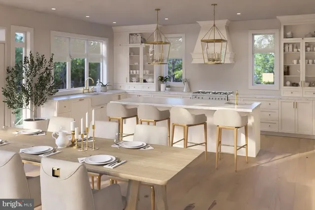 a kitchen with a table chairs stove and kitchen island