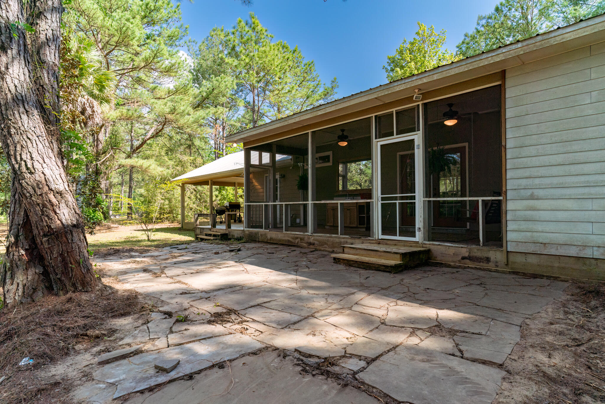 4353 Poverty Creek Road Crestview, FL 32539 - Photo 5 of 43 a view of a house with backyard and sitting area