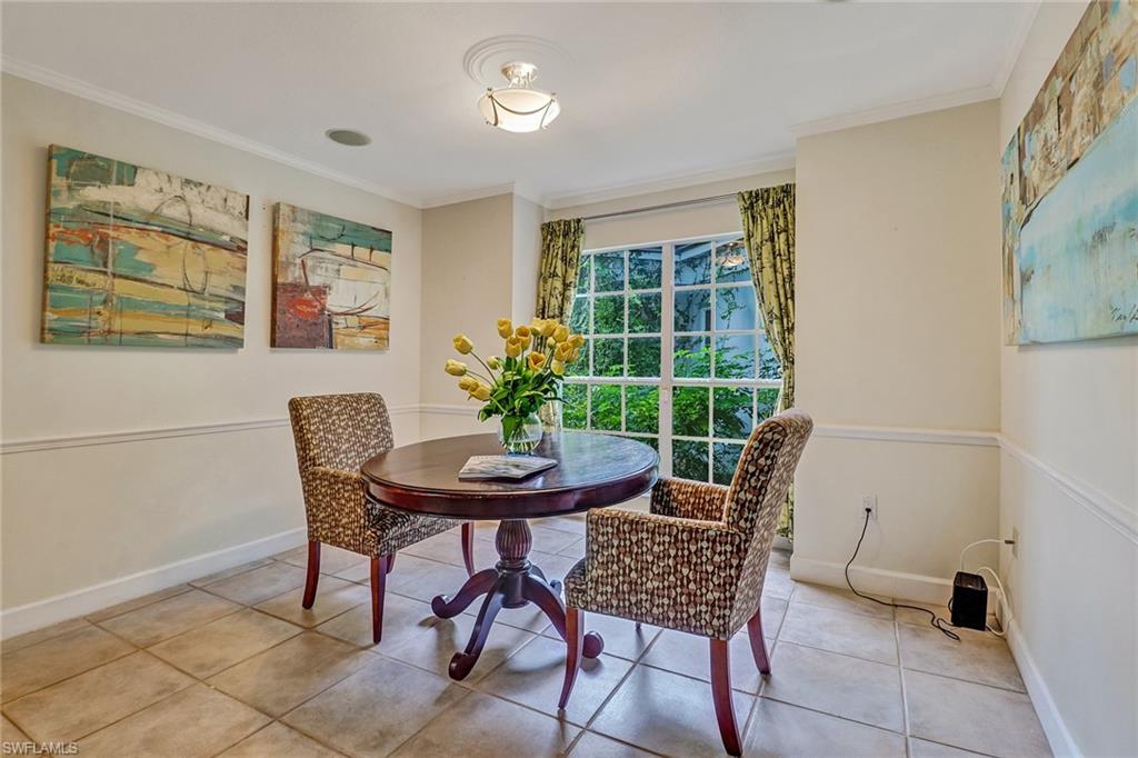 6917 Mill Run Road Naples, FL 34109 - Photo 14 of 29 a dining room with furniture and window