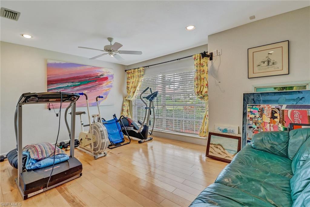 6917 Mill Run Road Naples, FL 34109 - Photo 15 of 29 a view of a room with gym equipment