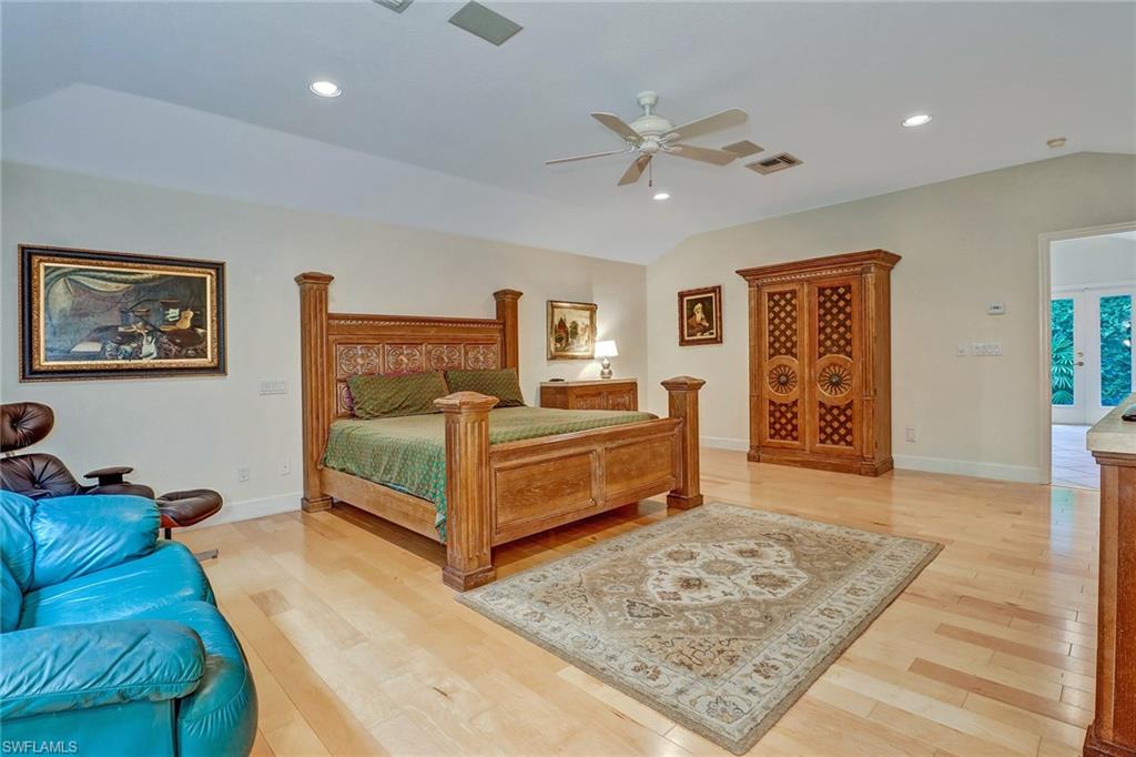 6917 Mill Run Road Naples, FL 34109 - Photo 23 of 29 a bedroom with a bed and a dresser