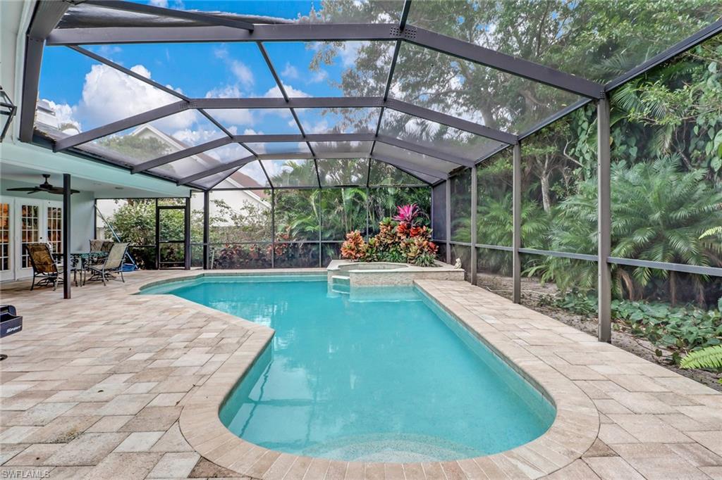 6917 Mill Run Road Naples, FL 34109 - Photo 29 of 29 a view of a swimming pool with a patio