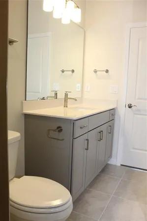 a bathroom with a shower and a glass door