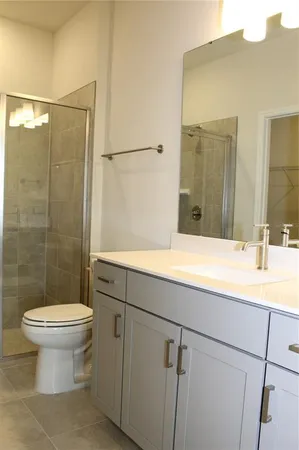 a bathroom with a double vanity sink and mirror