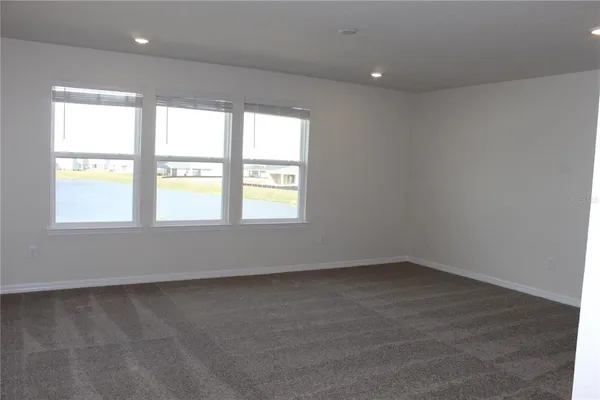 a view of a livingroom with furniture and a gym equipment