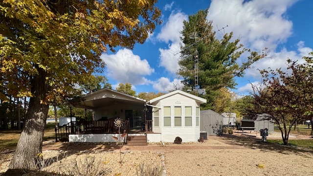 a view of a house with snow on the background
