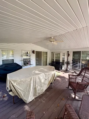 a bed room with a bed and large window