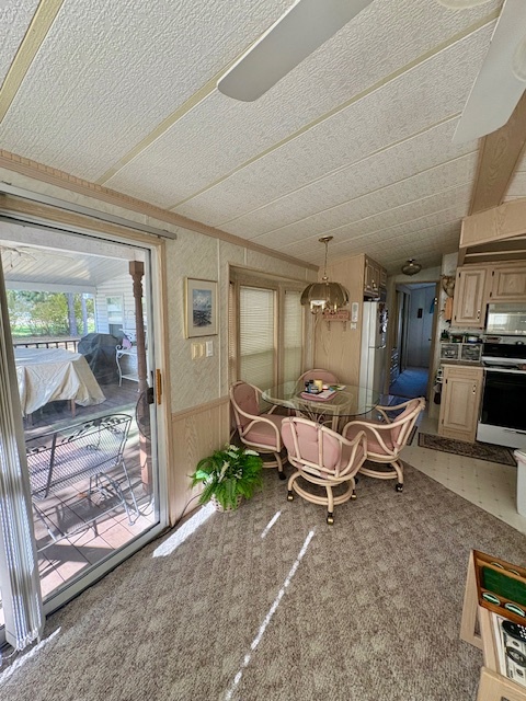 4-3&4 Woodhaven Sublette, IL 61367 - Photo 22 of 33 a living room with patio furniture and a floor to ceiling window