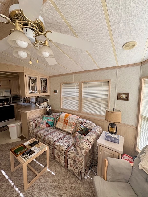 4-3&4 Woodhaven Sublette, IL 61367 - Photo 23 of 33 a living room with furniture a ceiling fan and a rug