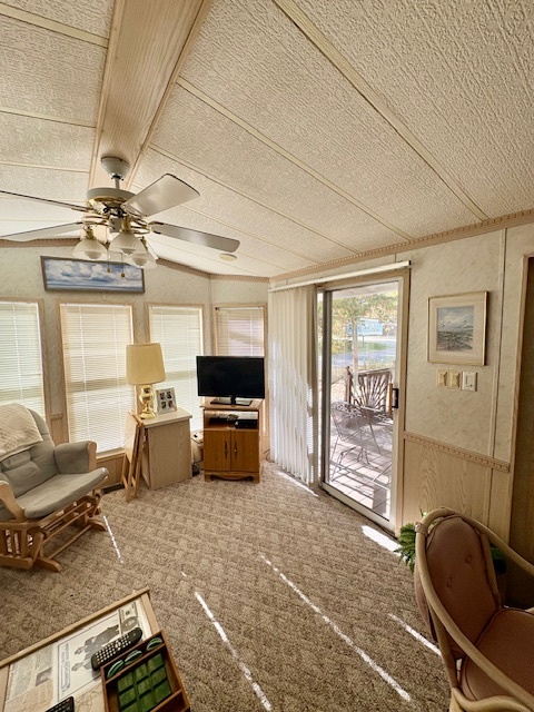 4-3&4 Woodhaven Sublette, IL 61367 - Photo 25 of 33 a living room with furniture a chandelier and a flat screen tv