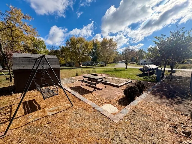 a view of a backyard with sitting area