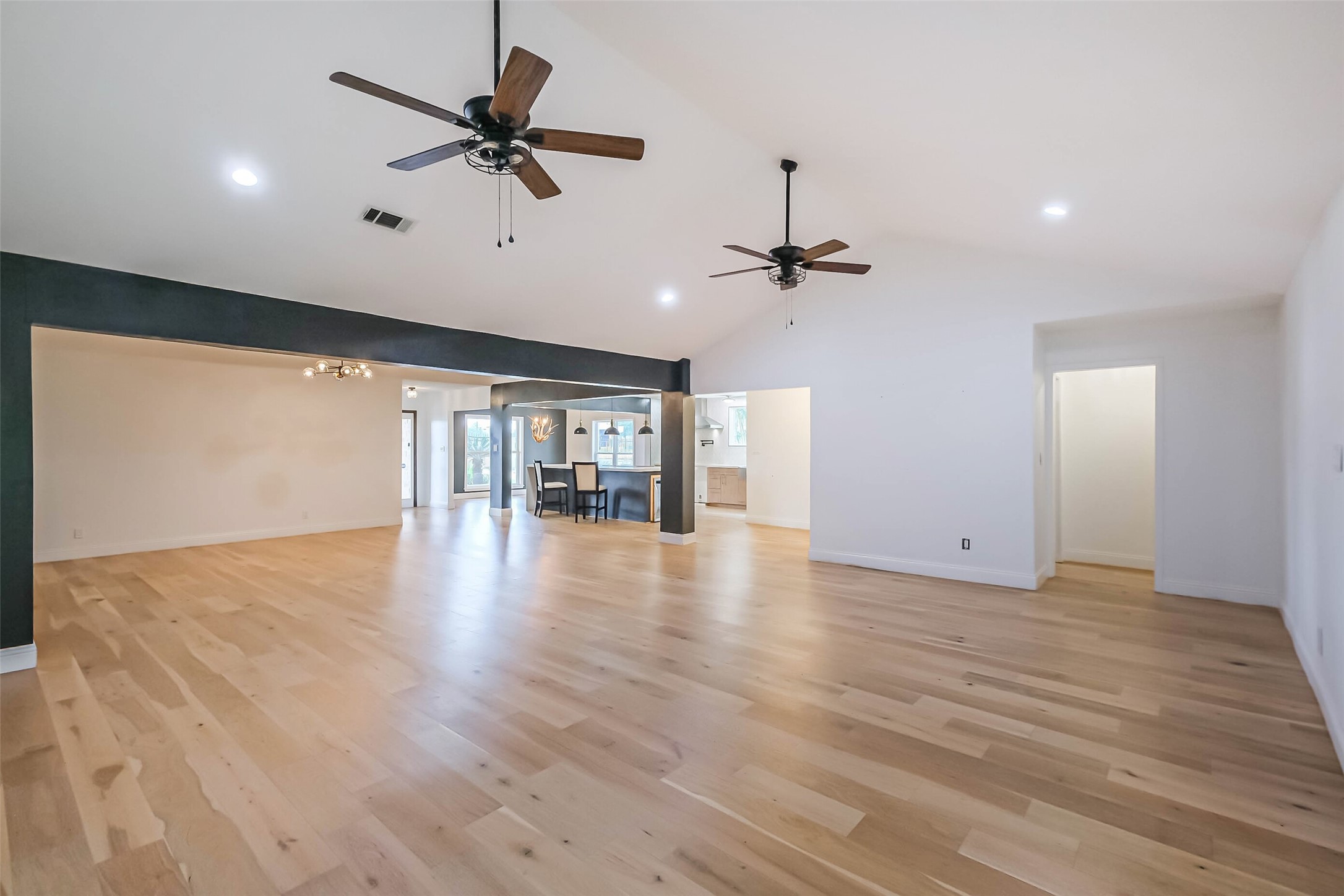 11019 Clodine Road Sugar Land, TX 77498 - Photo 5 of 39 a view of an empty room with a window and wooden floor
