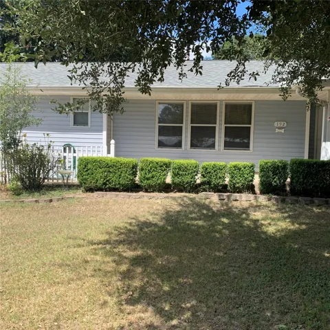 front view of a house with a garden