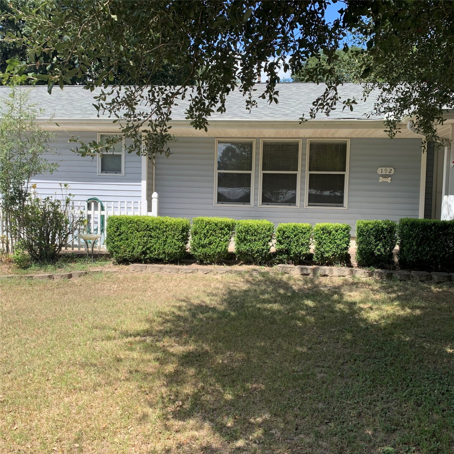 front view of a house with a garden