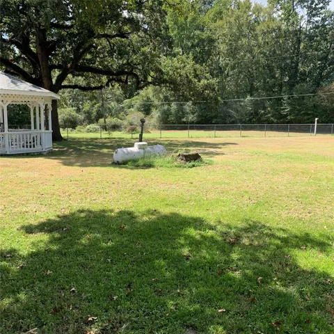 a view of a swimming pool with an outdoor space and seating area