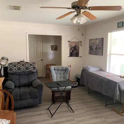 a bedroom with a bed and a couch