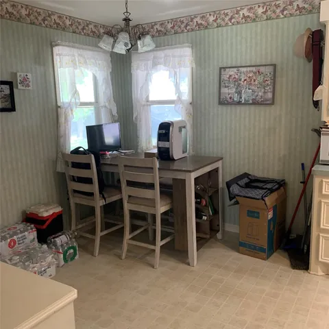 a kitchen with a cabinets and window