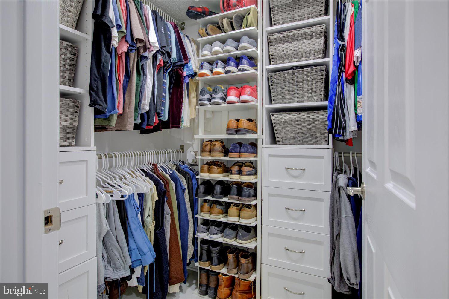 1515 South Arlington Ridge Road, Unit 305 Arlington, VA 22202 - Photo 18 of 41 a view of walk in closet with clothes and shoes