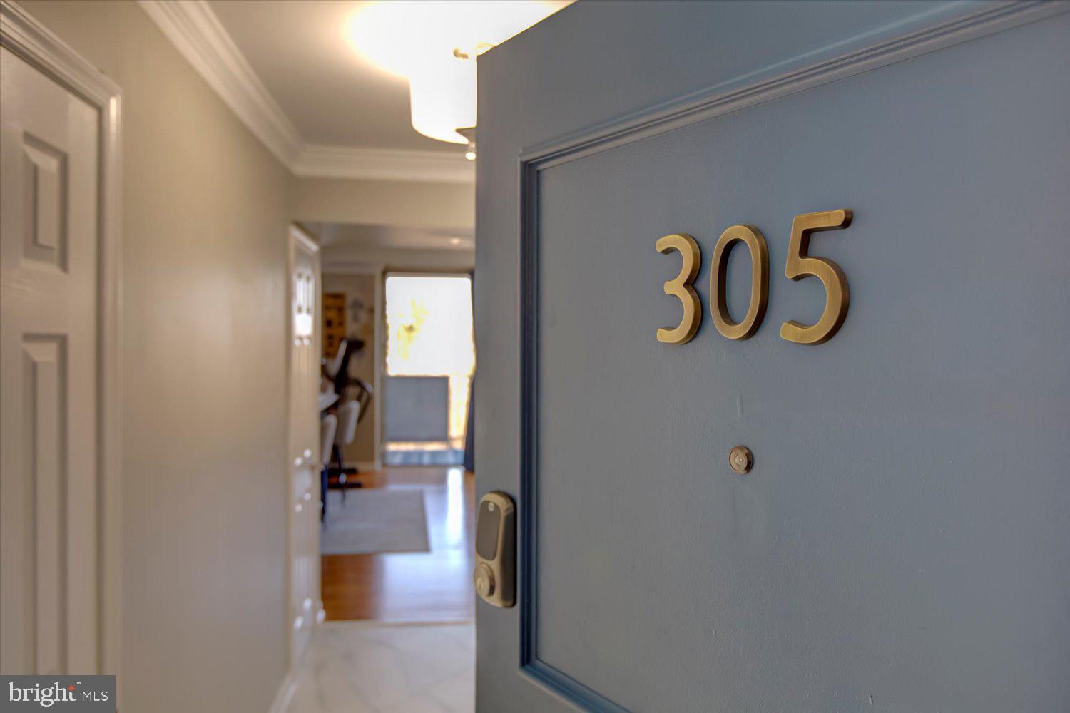 1515 South Arlington Ridge Road, Unit 305 Arlington, VA 22202 - Photo 2 of 41 a view of a hallway with wooden floor