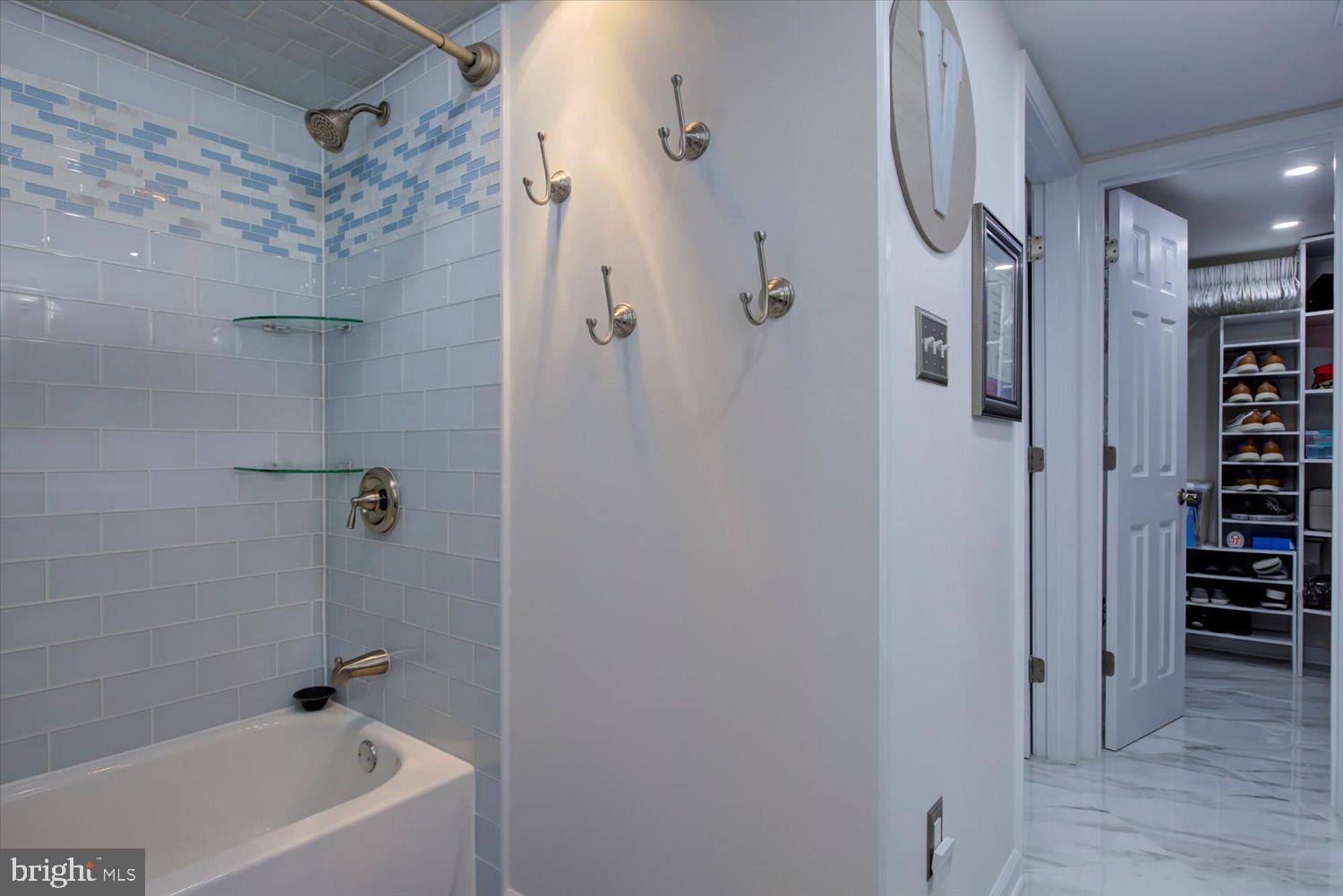 1515 South Arlington Ridge Road, Unit 305 Arlington, VA 22202 - Photo 21 of 41 a bathroom with a bathtub and a shower