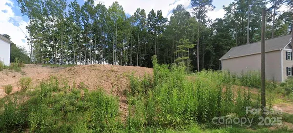 a view of a backyard of the house