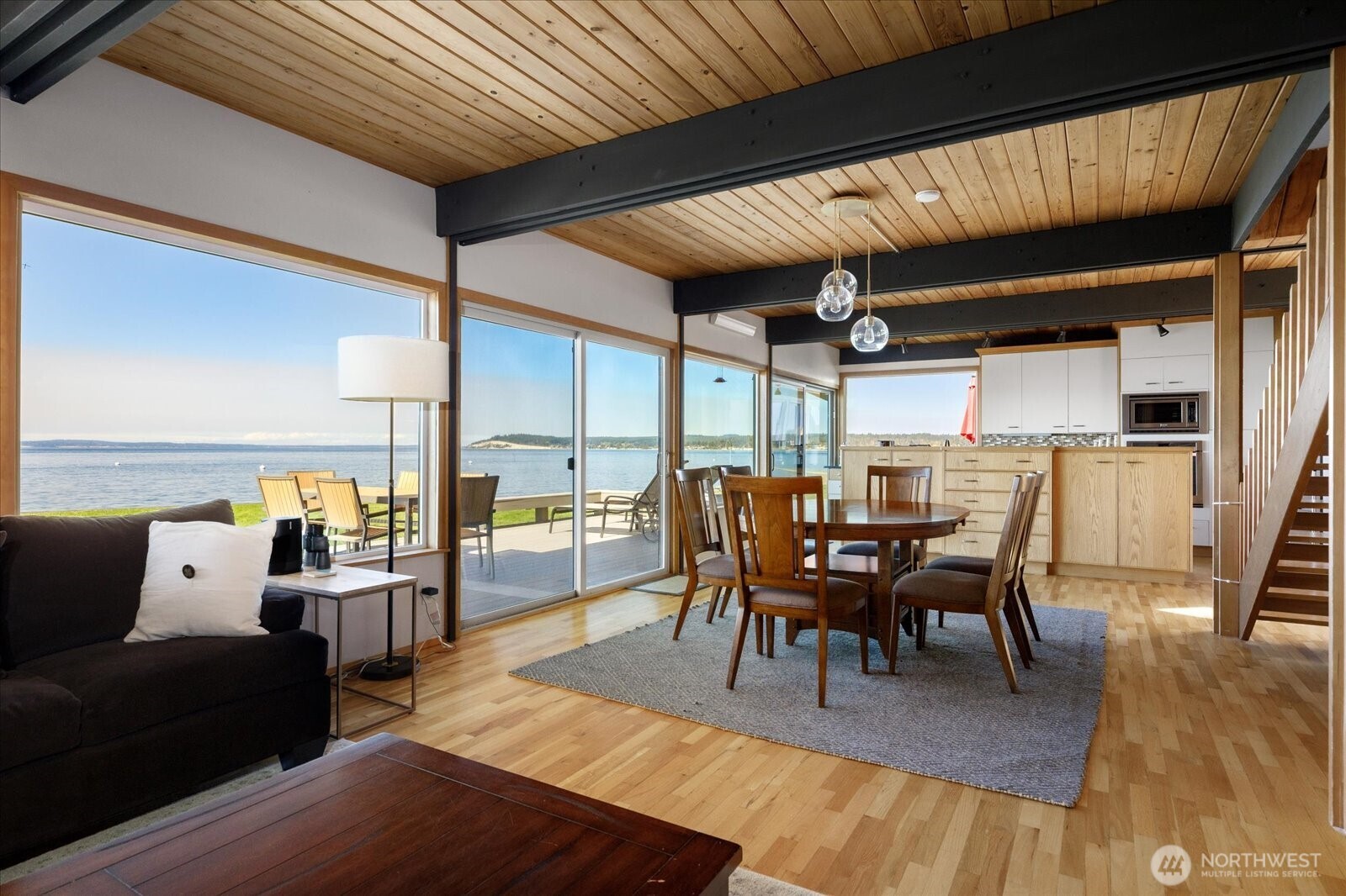 6278 Barr Beach Road Freeland, WA 98249 - Photo 20 of 40 a view of a dining room with furniture and wooden floor