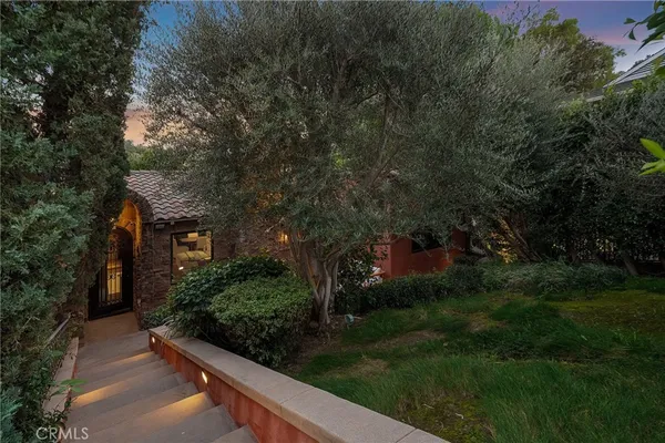 a view of house with yard and green space