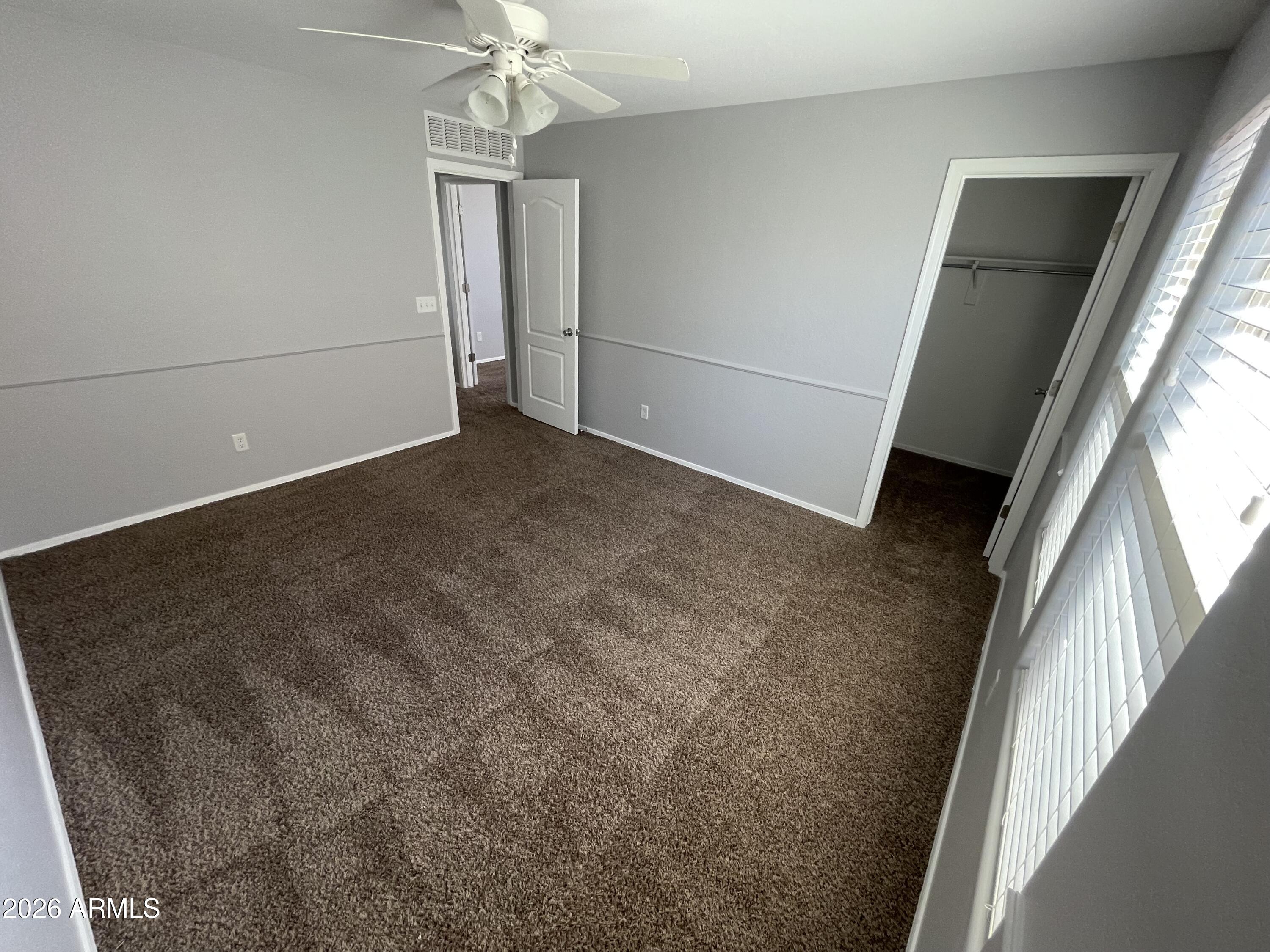 3448 East Merrill Avenue Gilbert, AZ 85234 - Photo 24 of 26 a view of a hallway with wooden floor and staircase