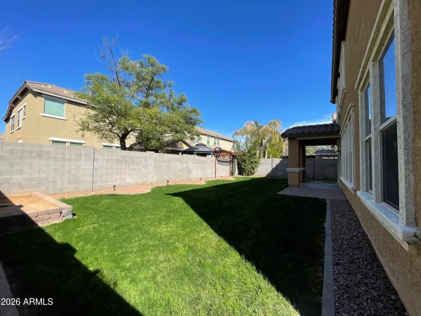 a view of a back yard of the house