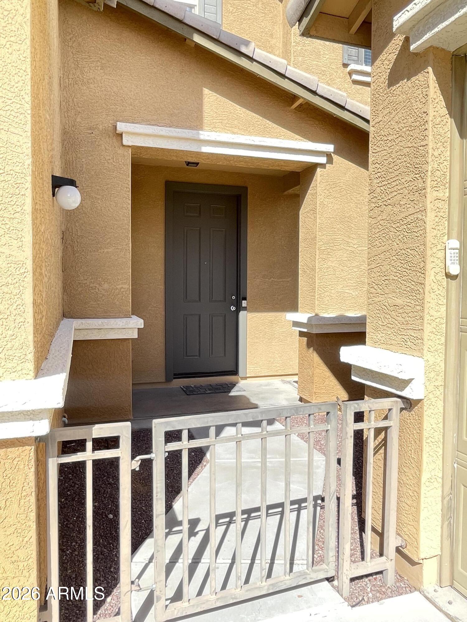3448 East Merrill Avenue Gilbert, AZ 85234 - Photo 4 of 26 a front view of a multi story residential apartment building