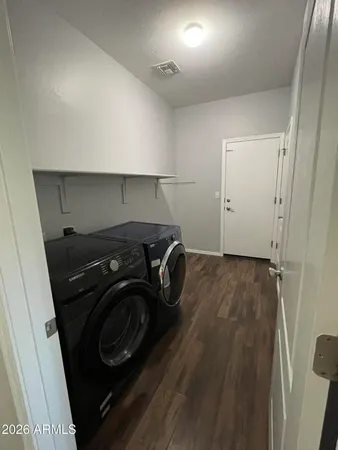 a utility room with dryer and washer