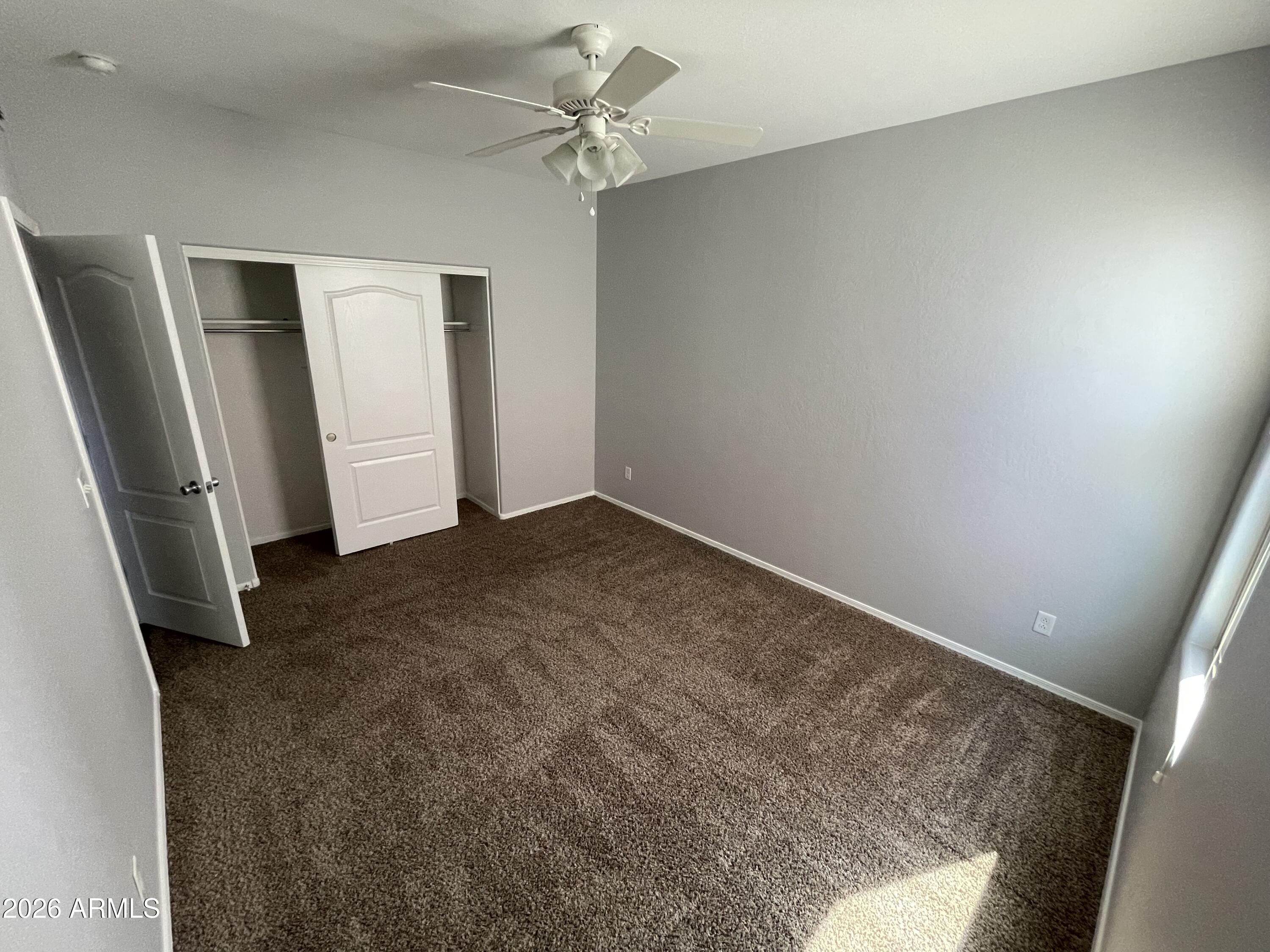 3448 East Merrill Avenue Gilbert, AZ 85234 - Photo 8 of 26 an empty room with a window