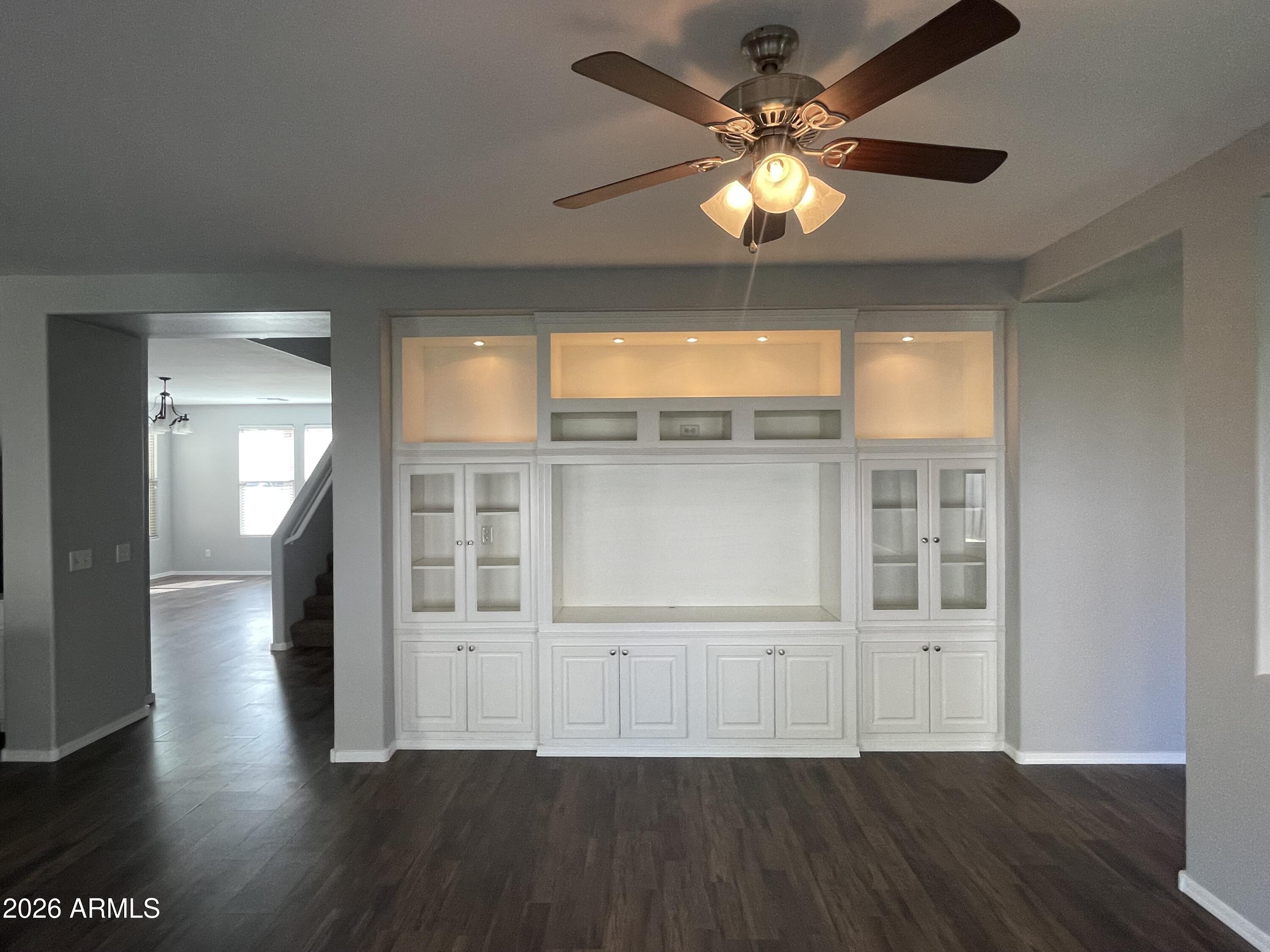 3448 East Merrill Avenue Gilbert, AZ 85234 - Photo 10 of 26 wooden floor in an empty room with a window