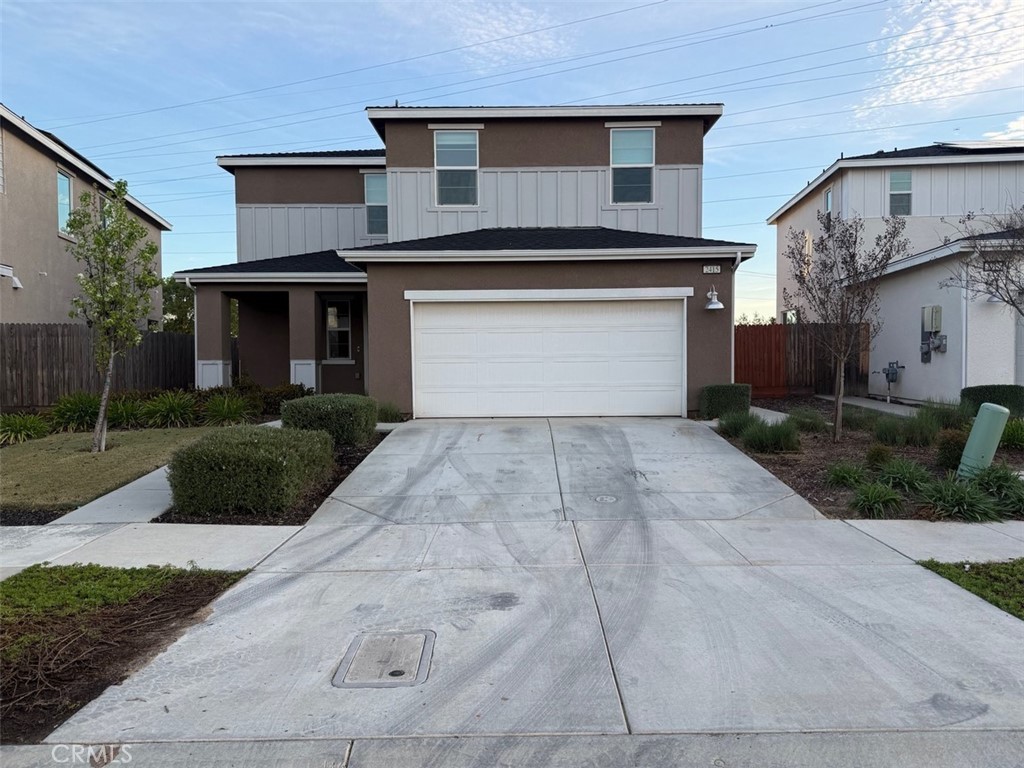 2415 Explorador Drive Merced, CA 95340 - Photo 1 of 28 a front view of a house with yard