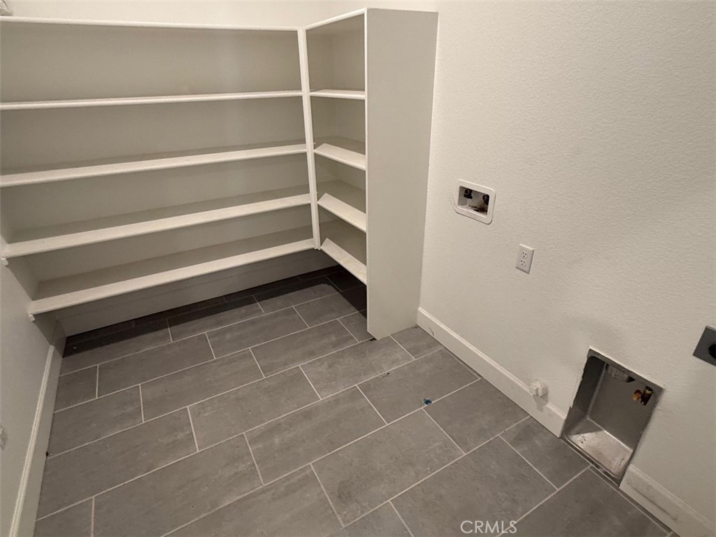 2415 Explorador Drive Merced, CA 95340 - Photo 12 of 28 a view of storage and utility room with empty racks