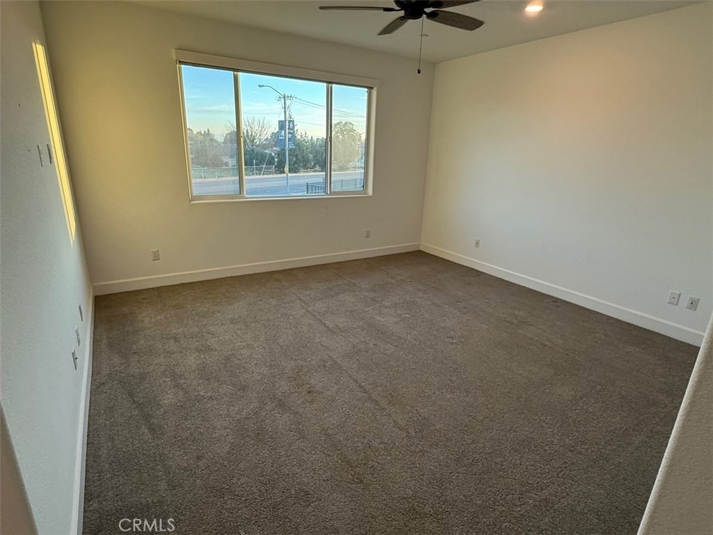 2415 Explorador Drive Merced, CA 95340 - Photo 13 of 28 an empty room with a window