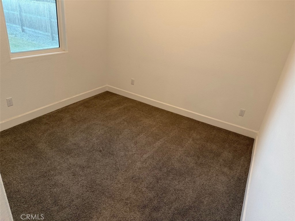 2415 Explorador Drive Merced, CA 95340 - Photo 17 of 28 an empty room with a window