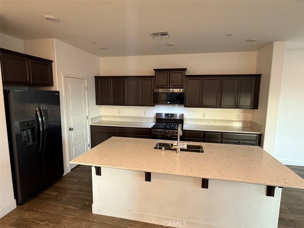 2415 Explorador Drive Merced, CA 95340 - Photo 19 of 28 a kitchen with stainless steel appliances a refrigerator and a stove top oven