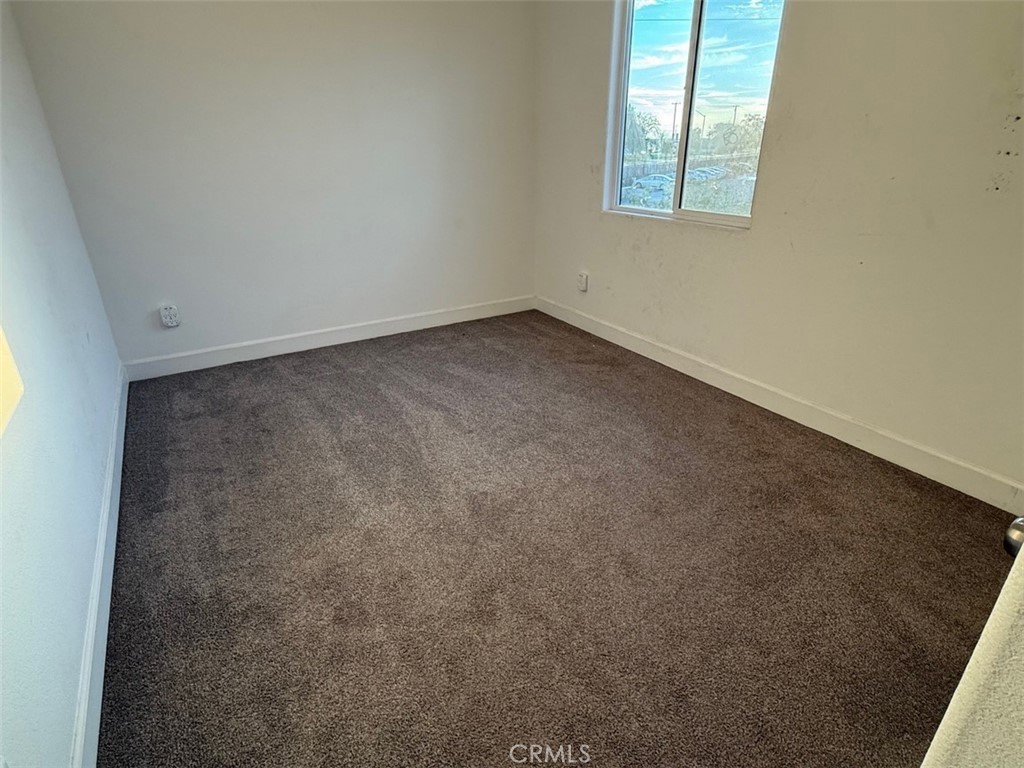2415 Explorador Drive Merced, CA 95340 - Photo 23 of 28 an empty room with windows