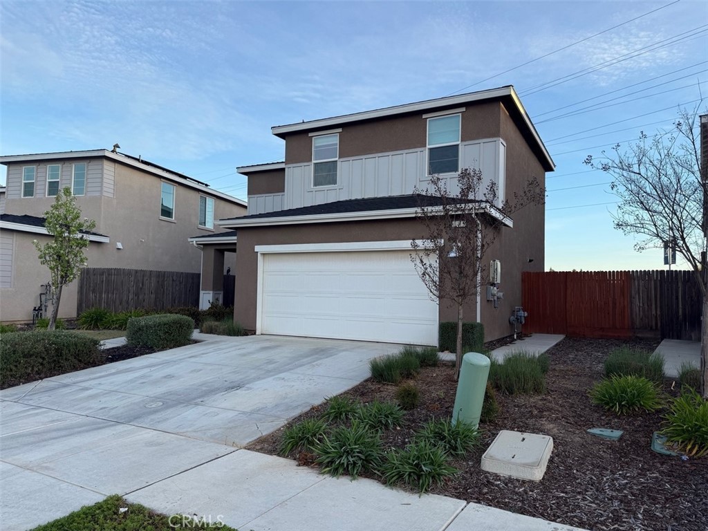 2415 Explorador Drive Merced, CA 95340 - Photo 3 of 28 a front view of a house with garden