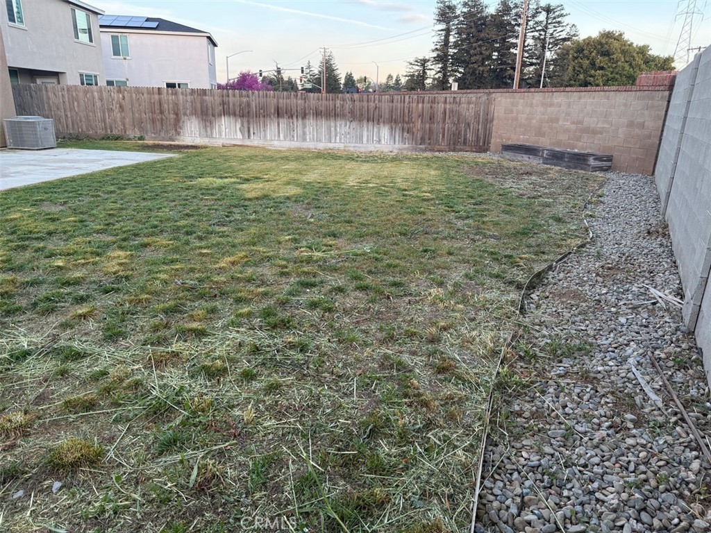 2415 Explorador Drive Merced, CA 95340 - Photo 4 of 28 a view of yard with a fence and trees
