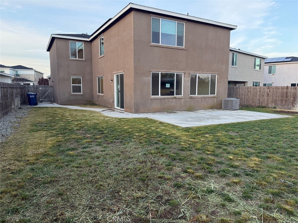 2415 Explorador Drive Merced, CA 95340 - Photo 7 of 28 a front view of a house with a yard