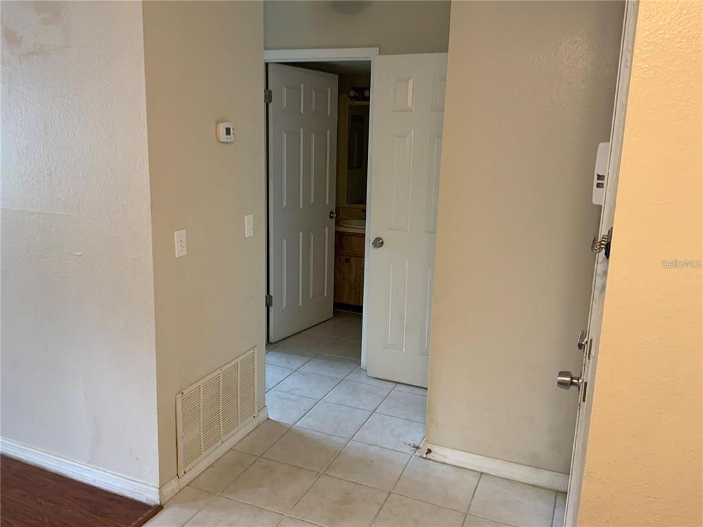 233 Red Maple Place, Unit 233 Brandon, FL 33510 - Photo 12 of 16 a view of a hallway with closet and a door